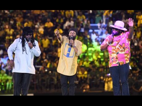 Credit: File Peetah Morgan (centre) performing with his brothers Mr Mojo Morgan (left) and Gramps Morgan after the reggae group accepted the Jamaica Reggae Icon Award at the Jamaica 61 Grand Gala held at the National Stadium, St Andrew, last August.