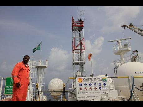 Credit: AP Sunday Alamba A member of Shell staff on the Bonga offshore oil Floating Production Storage and Offloading vessel off the coast of the Niger Delta in Nigeria, on December 26, 2011.