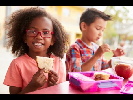 Representational image of schoolchildren eating lunch. Deborah Chen writes: It is imperative to lay utmost importance on the prevention of obesity in children and herald its progress.