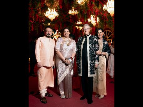 Credit: AP This photograph released by the Reliance group shows (from right) Paula Hurd, Bill Gates, Indian Minister of Women and Child Development Smriti Irani and her husband, Zubin Irani, at a pre-wedding bash of Mukesh Ambani’s son Anant Ambani.