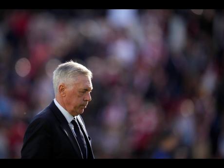Real Madrid’s head coach Carlo Ancelotti walks on the pitch at the end of a Spanish La Liga football match against Rayo Vallecano at the Vallecas stadium in Madrid, Spain, on February 18.