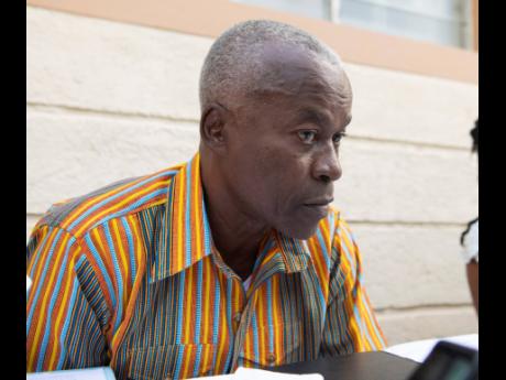 Credit: FIle Attorney-at-law Bert Samuels, who represents Shawn ‘Shawn Storm’ Campbell, listens closely to the judgment from the Court of Appeal which was delivered on April 3, 2020. Campbell and the three co-accused lost the appeal.