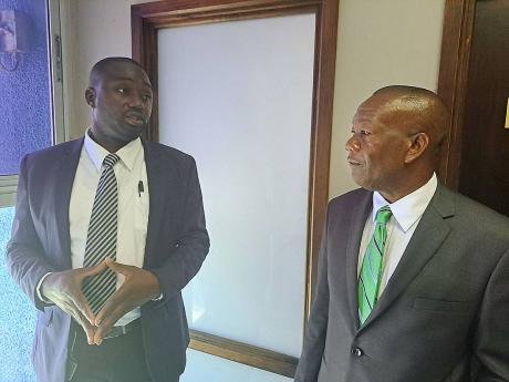 Anthony Murray (left), the Jamaica Labour Party’s (JLP) councillor for the Rose Hall division in the St James Municipal Corporation (StJMC), and Gregory Harris, the JLP councillor for the Salt Spring division, moments after they left the corporation’s 