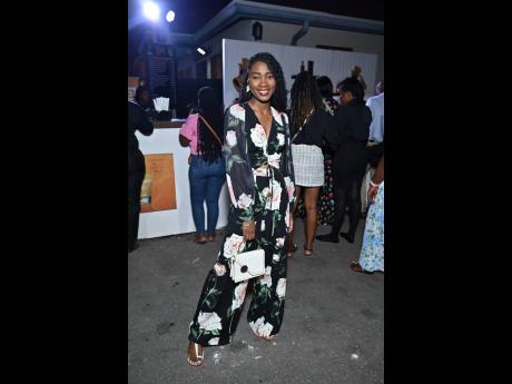 Deneille Service posing confidently in this floral two-piece pant suit.