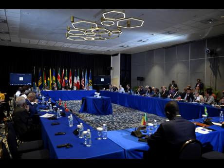 Front table from left, Barbados Prime Minister Mia Mottley, U.S. Secretary of State Antony Blinken, Guyana’s President Irfaan Ali and Jamaica’s Prime Minister Andrew Holness attend meeting on Haiti at the Conference of Heads of Government of the Caribb