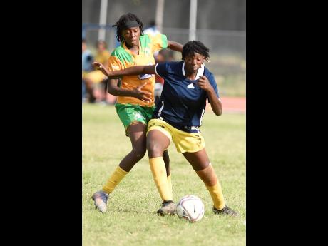 Credit: File Tyra Smith (right) of Garvey Maceo shields the ball from Cassandra Smith of Excelsior High during an ISSA TIP Friendly schoolgirls’ football match at the Ashenheim Stadium, Jamaica College, on April 20, 2023.
