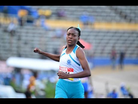 Lacovia High's Sabrina Dockery eases after winning semi-final two of the Class Two girls' 100 metres at the ISSA/GraceKennedy Boys and Girls' Athletics Championships at the National Stadium today. Dockery clocked 11.33 seconds for the final with the fastes
