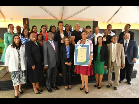 Minister without portfolio in the Office of the Prime Minister, with responsibility for skills and digital transformation, Senator Dr Dana Morris Dixon (fourth left, front row), and Acting Chief Executive Officer, eGov Jamaica Limited, Anika Shuttleworth (