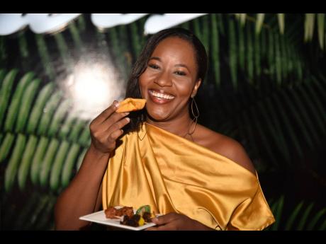 Jhunelle Jureidini gets ready to take a bite of the barbecued pork patty.