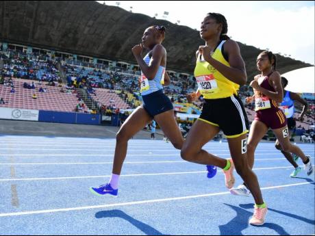 Edwin Allen High's Rickeisha Simms takes the lead in the Class One girls' 800 metres semi-final one at the ISSA/GraceKennedy Boys and Girls' Athletics Championships today at the National Stadium. Simms won in 2:16.18 minutes.