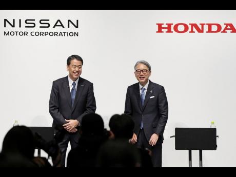Nissan Chief Executive Makoto Uchida, left, and Honda President Toshihiro Mibe attend a joint news conference in Tokyo, Friday, March 15, 2024.