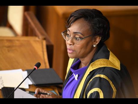 Speaker of the House, Juliet Holness. 