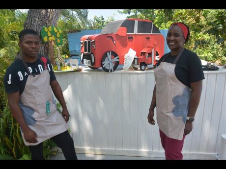 Husband and wife Gawayne and Ruchel James display some of their many 3D artwork models done over the years.