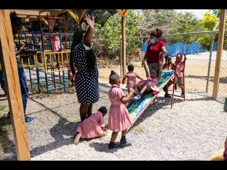 Dalaine Marriott, principal of Port Royal Basic School, observing pupils of the Port Royal Basic School during play time on March 21.