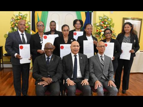 Credit: Contributed Governor General Sir Patrick Allen (seated centre); Chief Justice, Bryan Sykes (seated left); and President of the Court of Appeal, Justice Patrick Brooks (seated right), with members of the judiciary who were appointed to act in higher offices for the Eas
