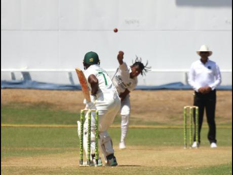 Jamaica Scorpions opener Javaughn Buchanan faces a delivery from Guyana Harpy Eagles pacer Isai Thorne during their West Indies Championship match at Sabina Park yesterday.