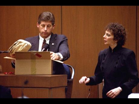 Los Angeles Police Detective Mark Fuhrman shows the jury in the O.J. Simpson double murder trial evidence found in the white Bronco that prosecutors contend defendant O.J. Simpson drove the night his ex-wife and a friend were murdered, during testimony Fri