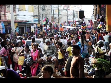 In this file photo shoppers are seen milling around in Beckford Street, downtown Kingston. 