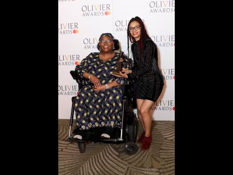 Matilda Feyisayo Ibini (left), winner of the unusual rigging award for Outstanding Achievement in Affiliate Theatre for ‘Sleepova’, poses with Jade Lewis in the winner’s room during the Olivier Awards on Sunday.