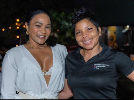Paula Nesbeth-Wright (left), company director, Viniflex, joins Simone Hull, marketing manager, Scotiabank Caribbean North, for a quick photo op.