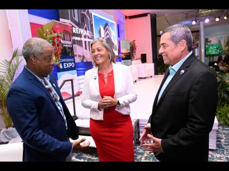 Ricky Cardenas (right), co-owner of the RE/MAX Caribbean and Central America Region, speaks with O’Neil Kirlew (left), a RE/MAX franchisee, and Hannah Rico Fletcher, RE/MAX Costa Rica’s regional director, at the RE/MAX Jamiaca Premier Real Estate confe
