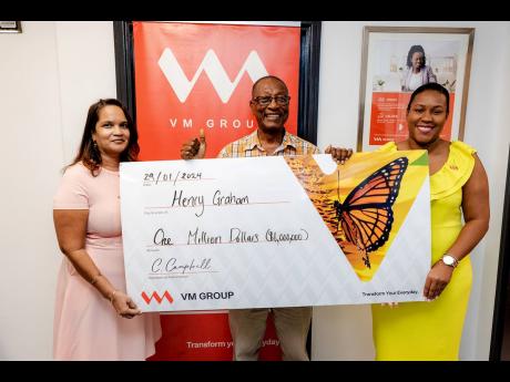 Henry Graham (centre), one of three grand prize winners in the VM iLive iSave iWin Millionaire promotion, receives his cheque from Suzette Ramdanie-Linton (left), assistant vice-president, Branch Distribution, and Allison Shields, manager – Sales and Ser