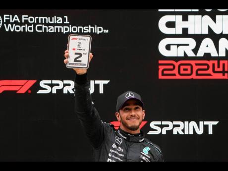 Credit: AP
Mercedes driver Lewis Hamilton of Britain reacts following his second-place finish in the sprint race at the Chinese Formula One Grand Prix at the Shanghai International Circuit, Shanghai, China, yesterday.