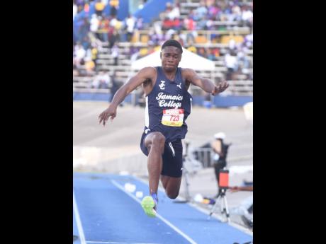 Chavez Penn of Jamaica College competes in the triple jump at Champs.