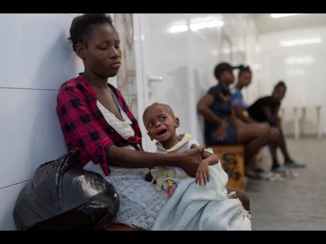 A malnourished child waits to be treated at a Doctors Without Borders emergency room in the Cité Soleil neighbourhood of Port-au-Prince.