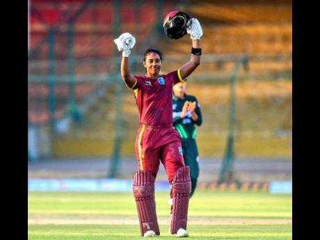West Indies captain and opener Hayley Matthews raises her arms in celebration of scoring her second century of an ODI series against Pakistan at the National Bank Stadium in Pakistan yesterday.