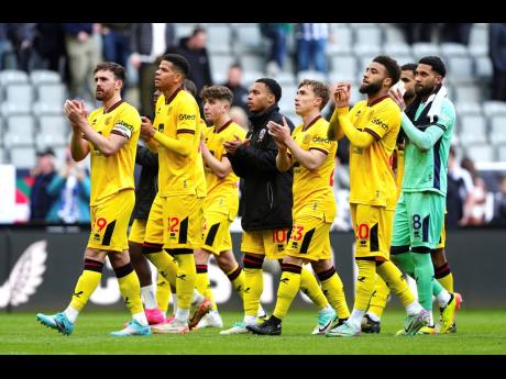 
Sheffield United players applaud the fans after the English Premier League football match against Newcastle United at St James’ Park, Newcastle, England, yesterday.