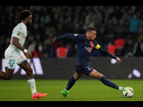 Credit: AP PSG’s Kylian Mbappe gets away from Le Havre’s Yoann Salmier during the French League One match between Paris Saint-Germain and Le Havre at the Parc des Princes in Paris on Saturday, April 27, 2024.