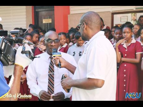 Credit: Contributed Paul Adams, principal of the Herbert Morrison Technical High School, is interviewed by Arnold Kelly, general manager, NCU Media Group, during an Acts of Kindness School Tour.
