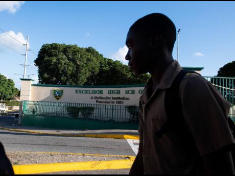 Credit: File In this 2022 photo a students is seen walking past Excelsior High School entrance where a student of the institution was stabbed outside of the schools premises