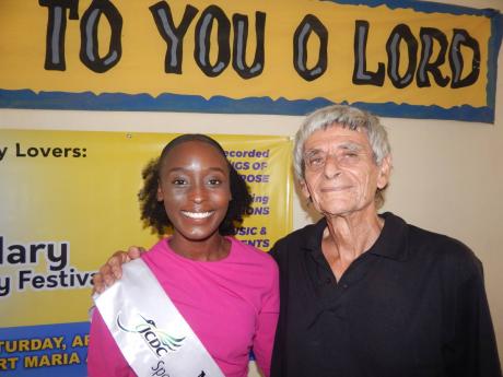 St Mary Festival Queen, Sherai Campbell,  poses with Paul Ward, organiser of the St Mary Literary Festival, held recently at the Anglican Church Hall in the parish.