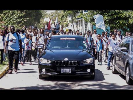 Credit: Contributed Students parade on the St George’s College campus, with cars provided by car enthusiasts, Street Xtream.