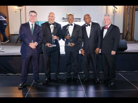 From left: Chairman of the Wisynco Group William Mahfood; President and CEO of Sagicor Group Christopher Zacca; President and CEO of VM Group Courtney Campbell; CEO and Chairman of Cari-Med Group Glen Christian and National Baking Company Chairman Gary ‘