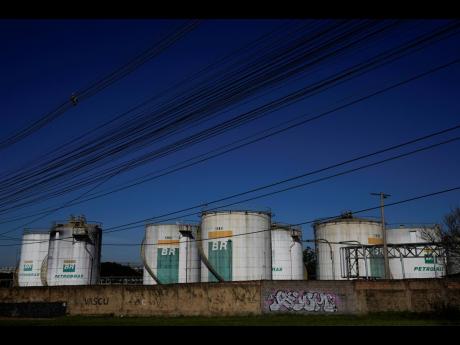 Credit: AP Eraldo Peres
Fuel reservoirs of the Petrobras Distribution Centre stand in Brasilia, Brazil, on Wednesday, May 15, 2024.