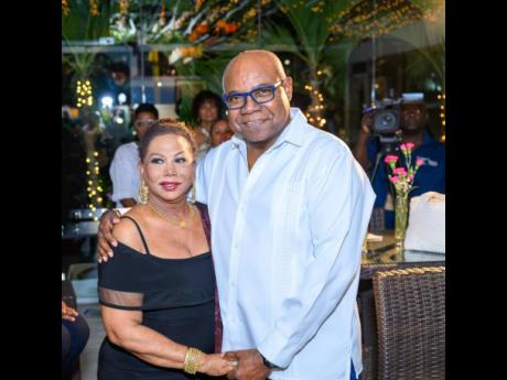 Sintra Bronte is embraced by Tourism Minister Edmund Bartlett.