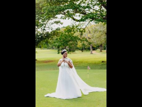 Credit: Joel Photography The bride, Candace Martin is regal in her custom Simply Majestic Designs gown.