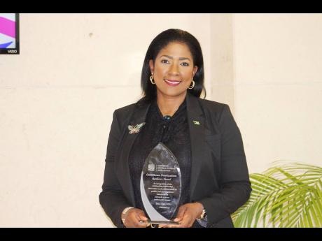 Credit: Paul H Williams Latia Duncombe, director general at The Bahamas Ministry of Tourism, Investments and Aviation displays the 2024 Caribbean Destination Resilience Category A Award that The Bahamas won.