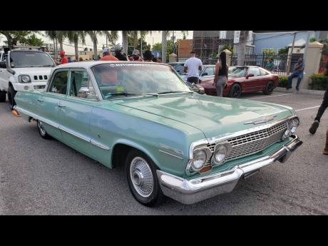 A Chevrolet Impala pumps out tunes, keeping the show lively. 