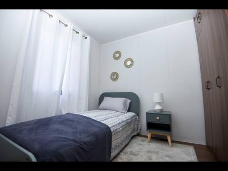 This secondary bedroom is ideal for a child or guest, or can make for a workspace for adults.