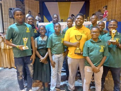 Credit: Contributed
Members of the St Jago High School chess team display the trophy they claimed at the 22nd staging of the Scholastic Team Chess Championships at the University of Technology on May 15.