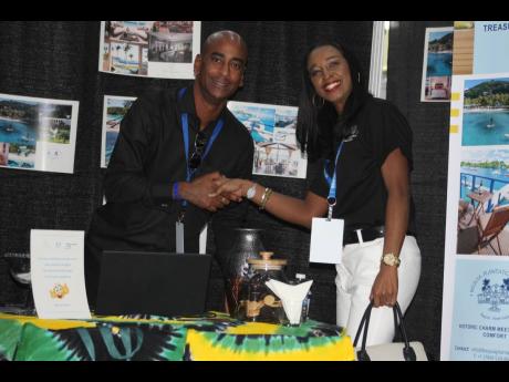 Credit: Paul Williams Pascal Lamothe, general manager, Bequia Plantation Hotel in Bequia, is greeted by Shauna Fung Yee of Down 2 Earth Agency, Jamaica.