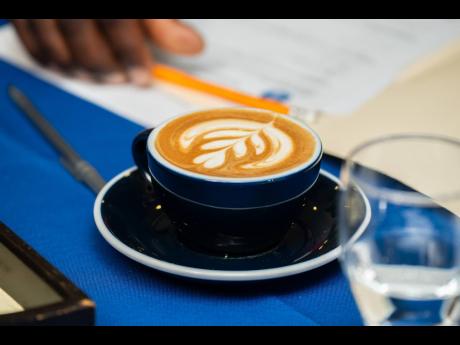 Romell Bailey showcases his lovely latte for the judges to have a taste of Guatemala. 