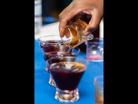 Sharing Elixir de Hibisco for the judges, Romell Bailey received the award for Best Signature Drink.