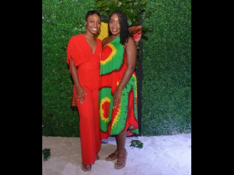 Kayla Harrison (left), director of sales at Inclusive Collection Jamaica, and Taji Reid, hotel manager at The Cliff Hotel, Negril, coincidentally coordinated their outfits with a touch of red.