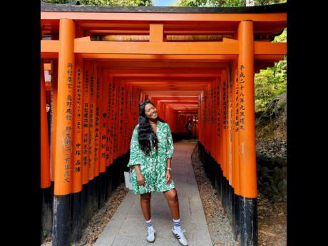 Hill-Afonso soaks up Asian history, exploring Japanese torii at the Fushimi Inari Shrine in Kyoto.