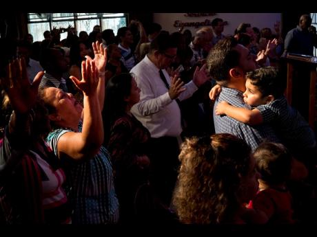 Evangelicals pray during a memorial service in Havana, Cuba, in May 2018. 